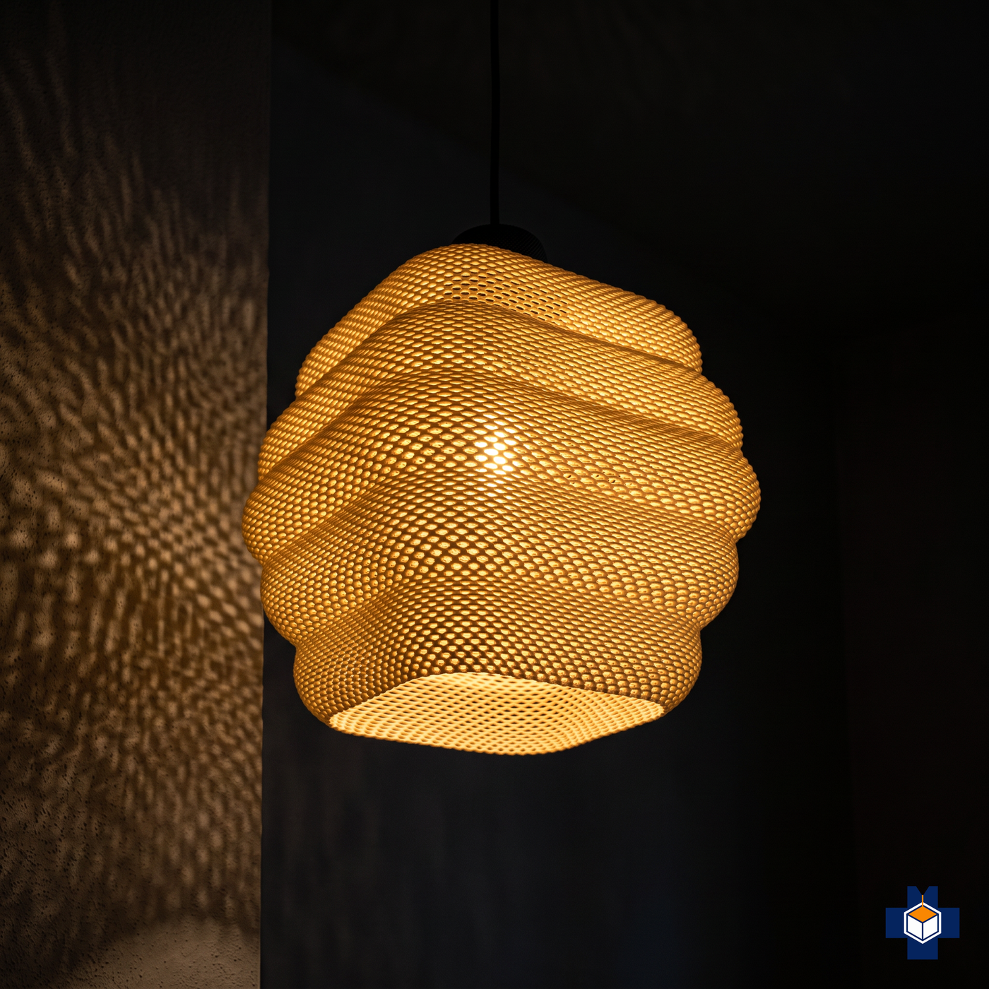 CLARISA pendant glowing at night, dappled light on the wall