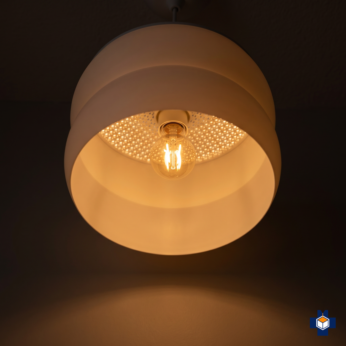 GYROID pendant light glowing, seen from below