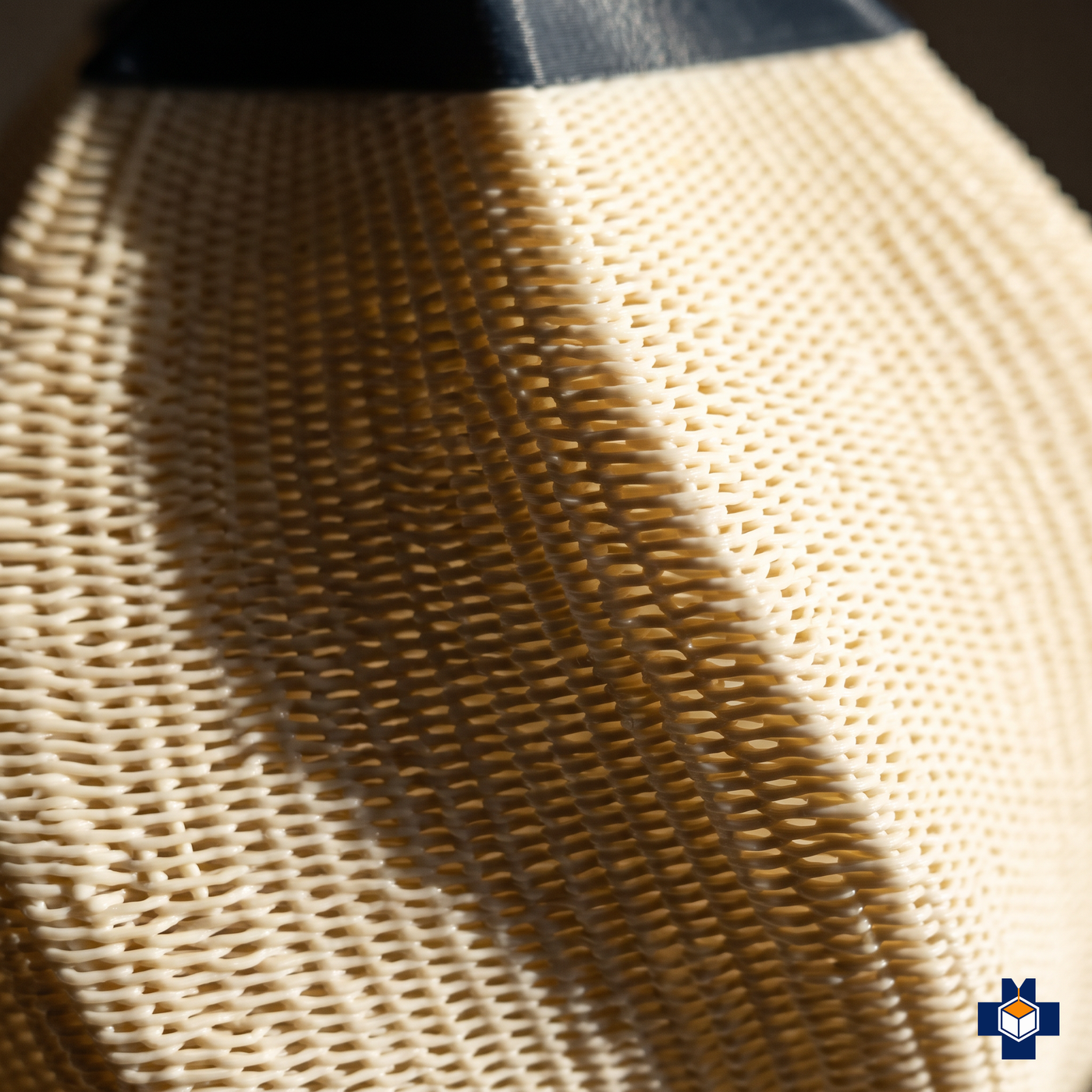 Close-up of the HELIX deep woven openwork spiral texture