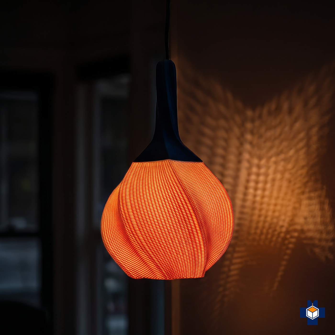 HELIX pendant light glowing warm at night, light through the openwork weave