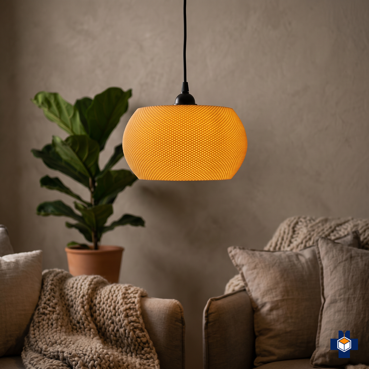 VALO pebble pendant light glowing in a cozy corner